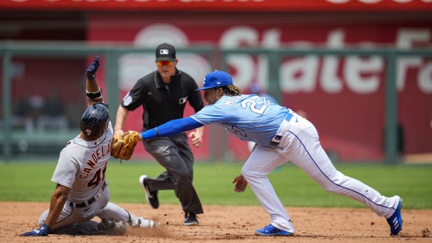 Jun 16, 2021; Kansas City, Missouri, USA; Detroit Tigers designated hitter Jeimer Candelario (46) slides into second base for a double ahead of the tag by Kansas City Royals shortstop Adalberto Mondesi (27) during the third inning at Kauffman Stadium. Mandatory Credit: Jay Biggerstaff-USA TODAY Sports