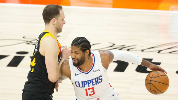 Jun 16, 2021; Salt Lake City, Utah, USA; LA Clippers guard Paul George (13) dribbles the ball against Utah Jazz forward Bojan Bogdanovic (44) during the first quarter of game five in the second round of the 2021 NBA Playoffs at Vivint Arena. Mandatory Credit: Russell Isabella-USA TODAY Sports