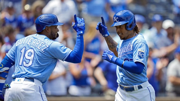 Jun 16, 2021; Kansas City, Missouri, USA; Kansas City Royals shortstop Adalberto Mondesi (27) is congratulated by third baseman Kelvin Gutierrez (19) after hitting a home run against the Detroit Tigers during the second inning at Kauffman Stadium. Mandatory Credit: Jay Biggerstaff-USA TODAY Sports