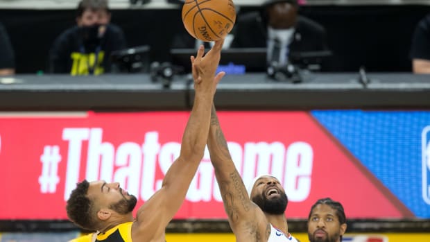 Jun 16, 2021; Salt Lake City, Utah, USA; Utah Jazz center Rudy Gobert (27) and LA Clippers forward Marcus Morris Sr. (8) compete for a jump ball to start game five in the second round of the 2021 NBA Playoffs at Vivint Arena. Mandatory Credit: Russell Isabella-USA TODAY Sports
