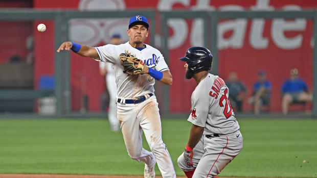 Jun 18, 2021; Kansas City, Missouri, USA; Kansas City Royals second baseman Nicky Lopez (8) makes a throw to first after forcing out Boston Red Sox base runner Danny Santana (22) during the fifth inning at Kauffman Stadium. Mandatory Credit: Peter Aiken-USA TODAY Sports