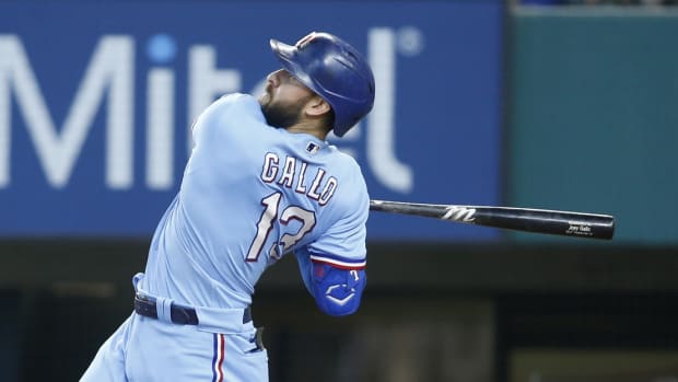 Jun 20, 2021; Arlington, Texas, USA; Texas Rangers right fielder Joey Gallo (13) follows through on a swing for a home run in the sixth inning against the Minnesota Twins at Globe Life Field.