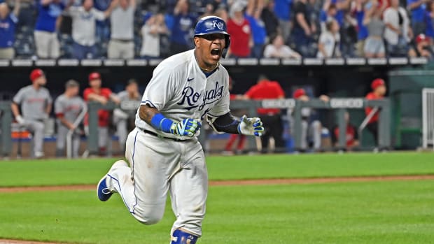 Jul 6, 2021; Kansas City, Missouri, USA; Kansas City Royals catcher Salvador Perez (13) reacts after driving in the winning run during the ninth inning against the Cincinnati Reds at Kauffman Stadium. Mandatory Credit: Peter Aiken-USA TODAY Sports