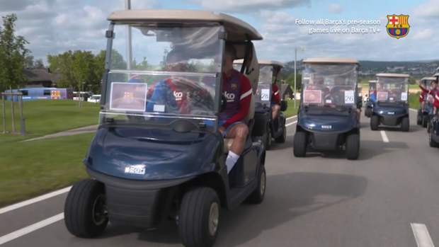 FC Barcelona players drive to training in golf carts