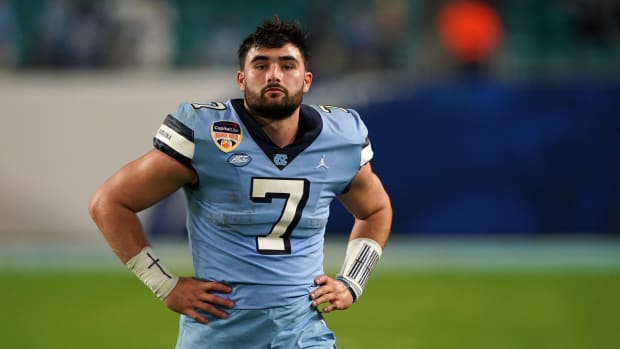 Jan 2, 2021; Miami Gardens, FL, USA; North Carolina Tar Heels quarterback Sam Howell (7) walks off the field after being defeated by the Texas A&M Aggies at Hard Rock Stadium.