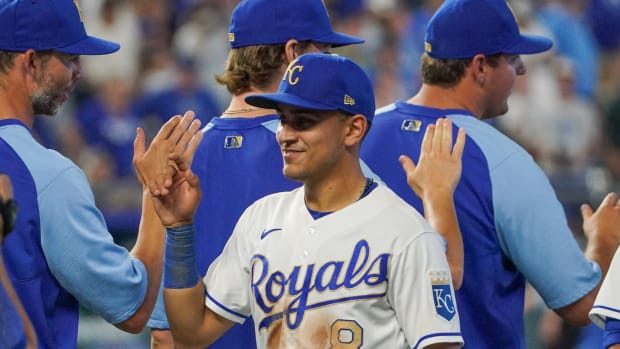 Jul 16, 2021; Kansas City, Missouri, USA; Kansas City Royals shortstop Nicky Lopez (8) is congratulated after the game against the Baltimore Orioles at Kauffman Stadium. Mandatory Credit: Denny Medley-USA TODAY Sports