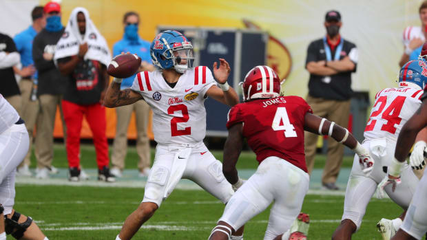 Jan 2, 2021; Tampa, FL, USA; Mississippi Rebels quarterback Matt Corral (2) throws he ball as Indiana Hoosiers linebacker Cam Jones (4) rushes during the second half at Raymond James Stadium.