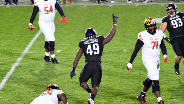 Northwestern Wildcats defensive lineman Adetomiwa Adebawore (49) celebrates his sack against the Maryland Terrapins during the second half at Ryan Field. David Banks-USA TODAY Sports