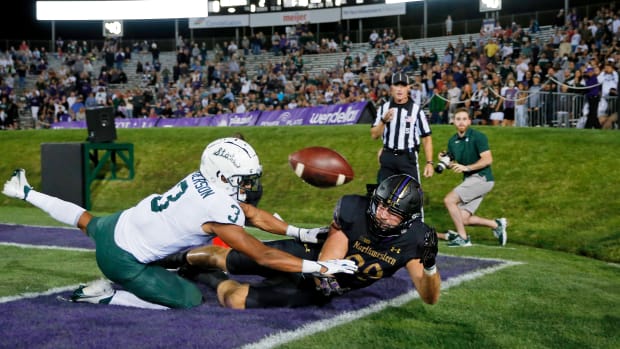 Northwestern Wildcats tight end Charlie Mangieri (89) is unable to stay inbounds as he reaches for the ball in front of Michigan State Spartans safety Xavier Henderson (3) during the second quarter at Ryan Field. Jon Durr-USA TODAY Sports