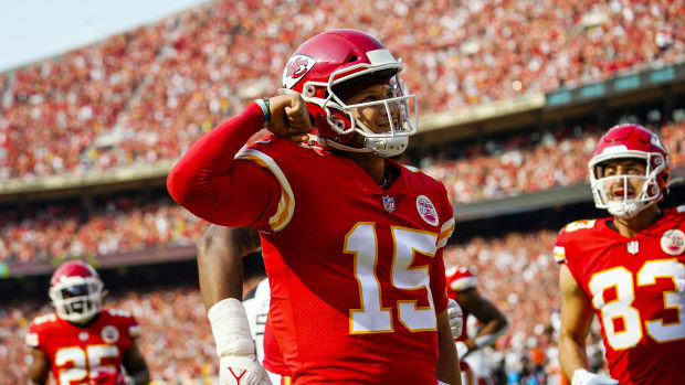 Sep 12, 2021; Kansas City, Missouri, USA; Kansas City Chiefs quarterback Patrick Mahomes (15) celebrates after scoring a touchdown against the Cleveland Browns during the first half at GEHA Field at Arrowhead Stadium. Mandatory Credit: Jay Biggerstaff-USA TODAY Sports