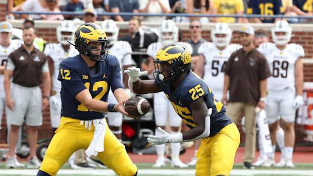 Cade McNamara and Hassan Haskins