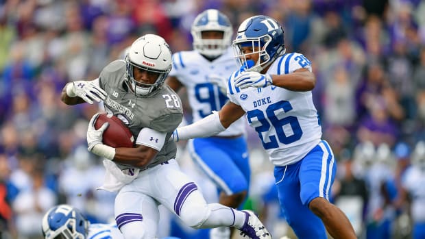 Sep 8, 2018; Evanston, IL, USA; Northwestern Wildcats running back Jeremy Larkin (28) runs with the ball in the first half against Duke Blue Devils safety Michael Carter II (26) at Ryan Field. Mandatory Credit: Quinn Harris-USA TODAY Sports