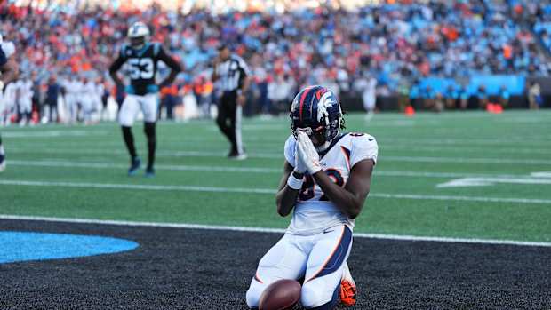 Denver Broncos wide receiver Brandon Johnson (89) reacts after catching a toudhdown in the fourth quarter at Bank of America Stadium.