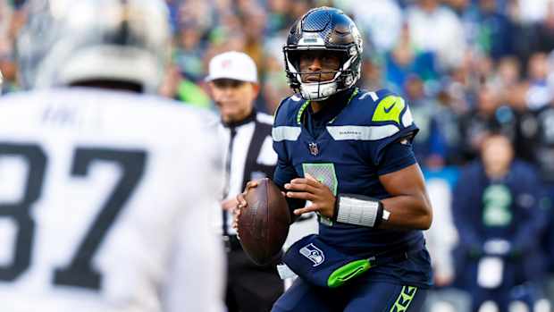 Nov 27, 2022; Seattle, Washington, USA; Seattle Seahawks quarterback Geno Smith (7) looks to pass against the Las Vegas Raiders during the first quarter at Lumen Field.