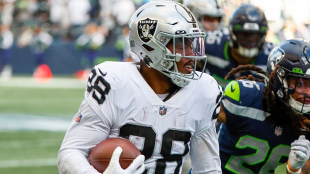 Nov 27, 2022; Seattle, Washington, USA; Las Vegas Raiders running back Josh Jacobs (28) eludes a tackle attempt by Seattle Seahawks linebacker Uchenna Nwosu (10) during the third quarter at Lumen Field.