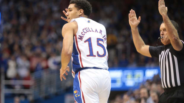 Kansas redshirt senior guard Kevin McCullar Jr. (15) looks back after sinking a three during the first half of Thursday's game against Seton Hall inside Allen Fieldhouse.