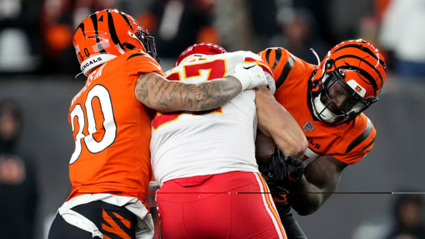 Dec 4, 2022; Cincinnati, Ohio, USA; Cincinnati Bengals linebacker Germaine Pratt (57) strips the ball from Kansas City Chiefs tight end Travis Kelce (87) for a turnover in the fourth quarter of a Week 13 NFL game at Paycor Stadium. Mandatory Credit: Kareem Elgazzar-USA TODAY Sports