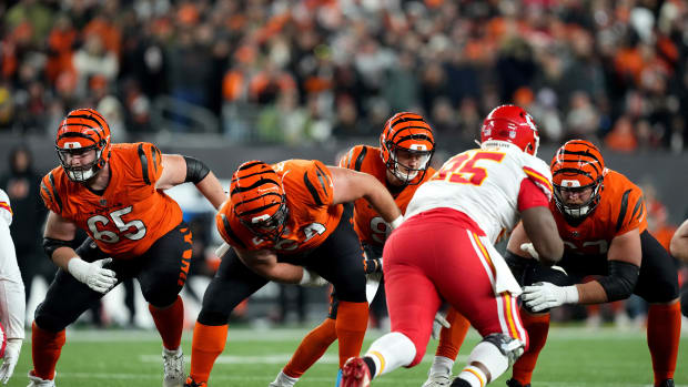 Dec 4, 2022; Cincinnati, Ohio, USA; Cincinnati Bengals quarterback Joe Burrow (9) takes a snap from Cincinnati Bengals center Ted Karras (64) in the third quarter of a Week 13 NFL game against the Kansas City Chiefs at Paycor Stadium. Mandatory Credit: Kareem Elgazzar-USA TODAY Sports