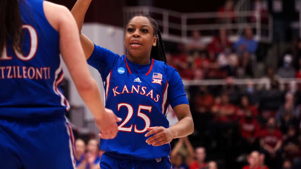 Mar 20, 2022; Stanford, California, USA; Kansas Jayhawks guard Chandler Prater (25) high fives forward Ioanna Chatzileonti (10) after a play against the Stanford Cardinal during the first quarter at Maples Pavilion. Mandatory Credit: Kelley L Cox-USA TODAY Sports