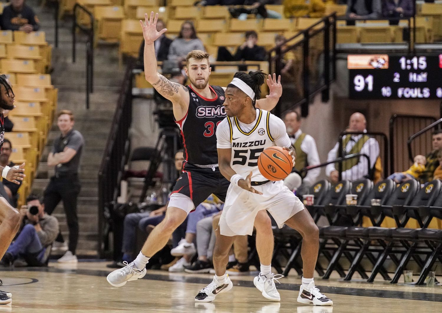 Dec 4, 2022; Columbia, Missouri, USA; Missouri Tigers guard Sean East II (55) dribbles the ball as Southeast Missouri State Redhawks guard Dylan Branson (33) defends during the second half at Mizzou Arena.