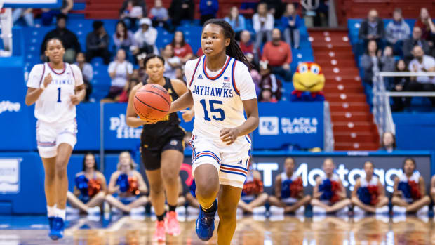 Kansas Jayhawks guard Zakiyah Franklin dribbles the ball up the court against the Wichita State Shockers in Allen Fieldhouse.