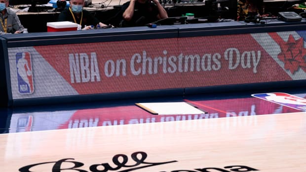 NBA on Christmas Day is displayed across the sideboards on a basketball court
