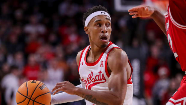 Dec 14, 2022; Cincinnati, Ohio, USA; Cincinnati Bearcats guard Mika Adams-Woods (3) dribbles against the Miami Redhawks in the first half at Fifth Third Arena. Mandatory Credit: Katie Stratman-USA TODAY Sports