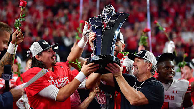 Utah Utes, Kyle Whittingham, quarterback Cameron Rising, trophy, Pac-12 Championship