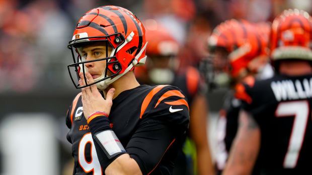 Cincinnati Bengals quarterback Joe Burrow (9) resets between plays in the second quarter of the NFL Week 14 game between the Cincinnati Bengals and the Cleveland Browns at Paycor Stadium in Cincinnati on Sunday, Dec. 11, 2022. The Bengals led 13-3 at halftime. Cleveland Browns At Cincinnati Bengals Week 14