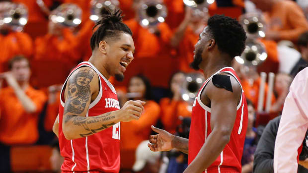 Houston Cougars forward Kadin Shedrick (21) celebrates with forward Jayden Gardner (1) after defeating the Virginia Cavaliers