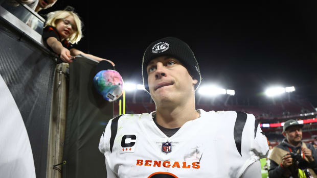 Dec 18, 2022; Tampa, Florida, USA; Cincinnati Bengals quarterback Joe Burrow (9) talks off the field after they best the Tampa Bay Buccaneers at Raymond James Stadium. Mandatory Credit: Kim Klement-USA TODAY Sports