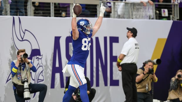 Dec 24, 2022; Minneapolis, Minnesota, USA; New York Giants tight end Daniel Bellinger (82) celebrates his two point conversion against the Minnesota Vikings during the fourth quarter at U.S. Bank Stadium.