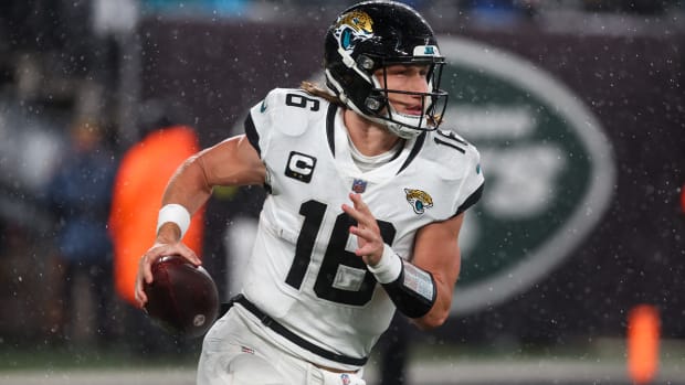 Dec 22, 2022; East Rutherford, New Jersey, USA; Jacksonville Jaguars quarterback Trevor Lawrence (16) runs with the ball against the New York Jets during the first half at MetLife Stadium.