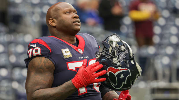 Texans offensive tackle Laremy Tunsil warms up on the field before a game.
