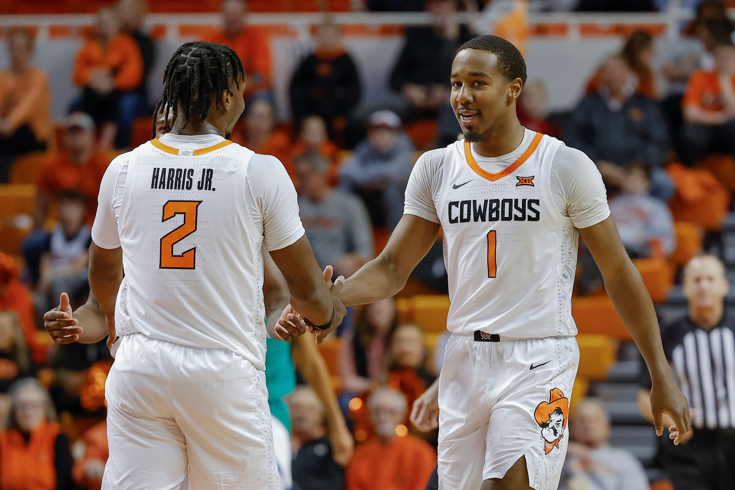 Dec 20, 2022; Stillwater, Oklahoma, USA; Oklahoma State Cowboys guard Bryce Thompson (1) and guard Chris Harris Jr. (2) celebrate after a play against the Texas A&M-Corpus Christi Islanders during the second half at Gallagher-Iba Arena. Oklahoma State won 81-58.
