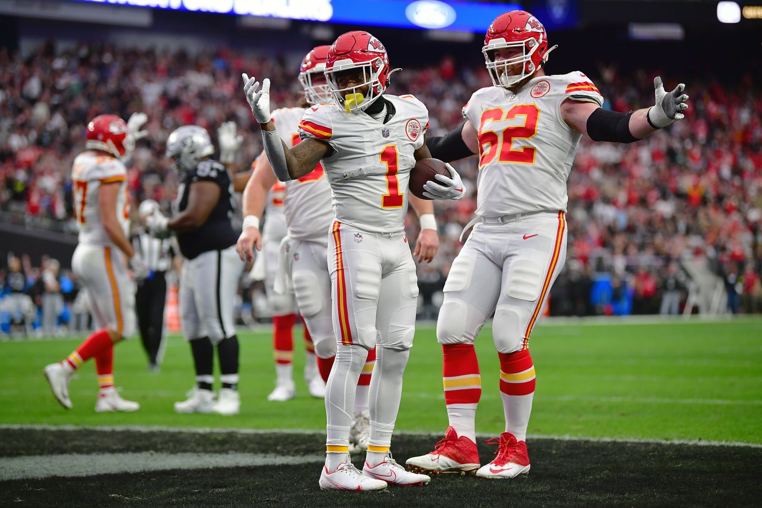 Jan 7, 2023; Paradise, Nevada, USA; Kansas City Chiefs running back Jerick McKinnon (1) celebrates his touchdown scored against the Las Vegas Raiders with guard Joe Thuney (62) during the first half at Allegiant Stadium. Mandatory Credit: Gary A. Vasquez-USA TODAY Sports