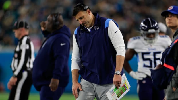 Tennessee Titans head coach Mike Vrabel listens on his headset during the second quarter of an NFL football regular season matchup AFC South division title game Saturday, Jan. 7, 2023 at TIAA Bank Field in Jacksonville.