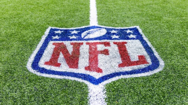 An NFL logo painted on the field before a game.