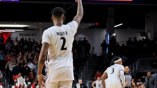 Jan 11, 2023; Cincinnati, Ohio, USA; Cincinnati Bearcats guard Landers Nolley II (2) reacts to making a three-point basket against the East Carolina Pirates in the second half at Fifth Third Arena. Mandatory Credit: Aaron Doster-USA TODAY Sports