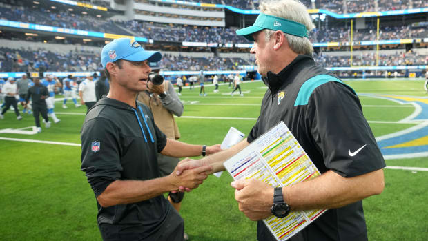Sep 25, 2022; Inglewood, California, USA; Los Angeles Chargers head coach Brandon Staley (left) meets with Jacksonville Jaguars head coach Doug Pederson after the game at SoFi Stadium. Mandatory Credit: Kirby Lee-USA TODAY Sports