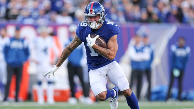 Jan 1, 2023; East Rutherford, New Jersey, USA; New York Giants wide receiver Isaiah Hodgins (18) gains yards after the catch during the first half against the Indianapolis Colts at MetLife Stadium.