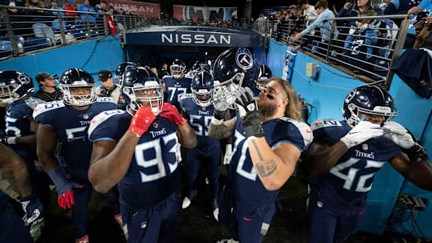 Tennessee Titans offensive and defensive lineman huddle in the tunnel before the game against the Dallas Cowboys at Nissan Stadium Thursday, Dec. 29, 2022, in Nashville, Tenn.