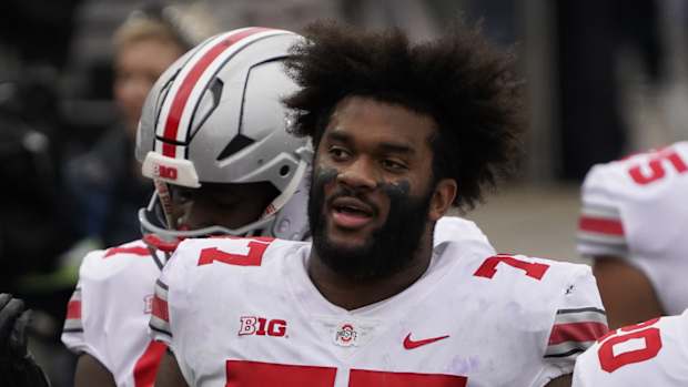 Ohio State LT Paris Johnson Jr. stands on sideline