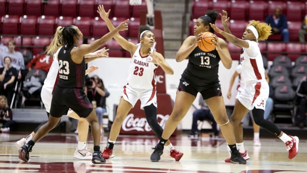 Texas A&M forward Jada Malone (13) looks for a passing lane to Texas A&M guard McKinzie Green (23) with Alabama guard Sarah Ashlee Barker (3), Alabama guard Brittany Davis (23), and Alabama guard Loyal McQueen