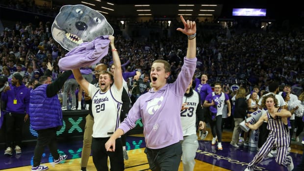 Jan 17, 2023; Manhattan, Kansas, USA; Kansas State Wildcats fans rush the court following an overtime win against the Kansas Jayhawks at Bramlage Coliseum. Mandatory Credit: Scott Sewell-USA TODAY Sports