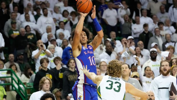 Jan 23, 2023; Waco, Texas, USA; Kansas Jayhawks forward Jalen Wilson (10) scores a three-point basket against Baylor Bears forward Caleb Lohner (33) during the first half at Ferrell Center.
