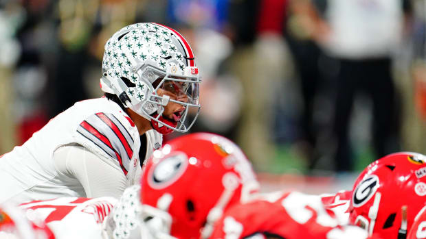 Dec 31, 2022; Atlanta, Georgia, USA; Ohio State Buckeyes quarterback C.J. Stroud (7) prepares to snap the ball against the Georgia Bulldogs during the second quarter of the 2022 Peach Bowl at Mercedes-Benz Stadium.