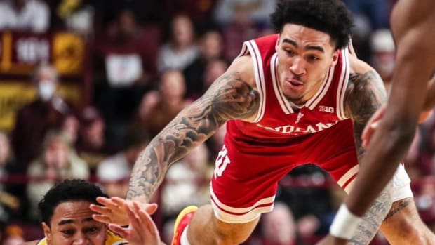 Indiana guard Jalen Hood-Schifino battles for a loose ball against the Minnesota Golden Gophers during Wednesday's game.