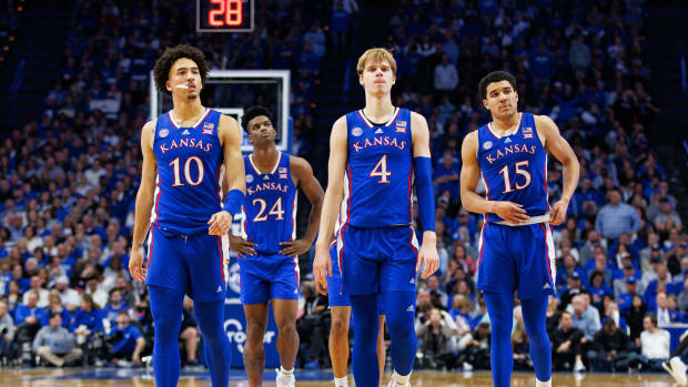 Jan 28, 2023; Lexington, Kentucky, USA; Kansas Jayhawks forward Jalen Wilson (10), guard Gradey Dick (4) and guard Kevin McCullar Jr. (15) walk down the court during the second half against the Kentucky Wildcats at Rupp Arena at Central Bank Center. Mandatory Credit: Jordan Prather-USA TODAY Sports