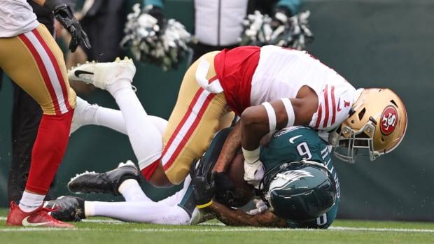 49ers cornerback Jimmie Ward tackles Eagles receiver DeVonta Smith in the first quarter of the 2022 NFC championship.